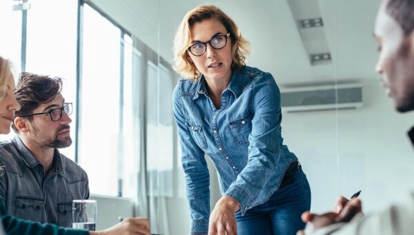 Executive conducting a business meeting