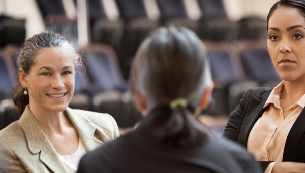 colleagues discussing around a table.