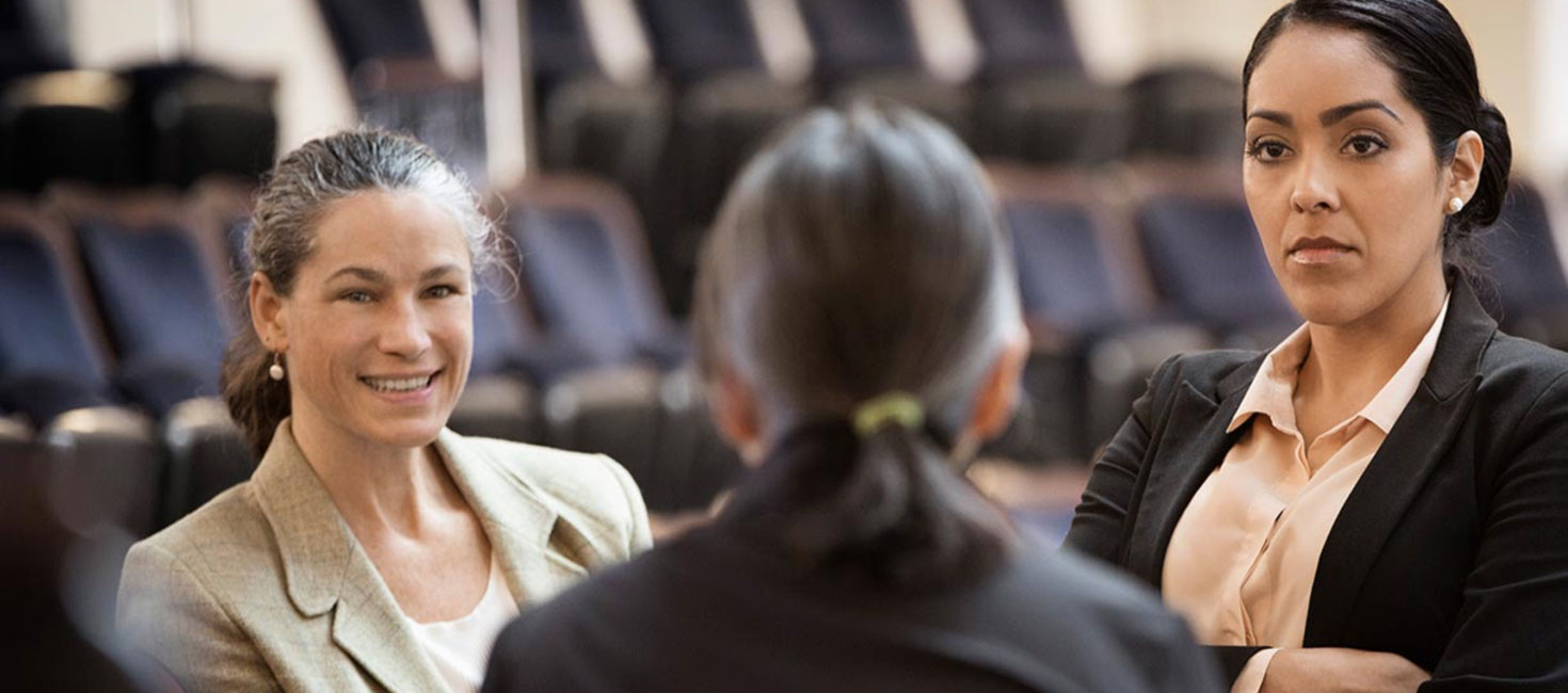 colleagues discussing around a table.