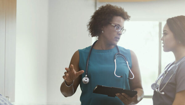 Head nurse speaking to a team
